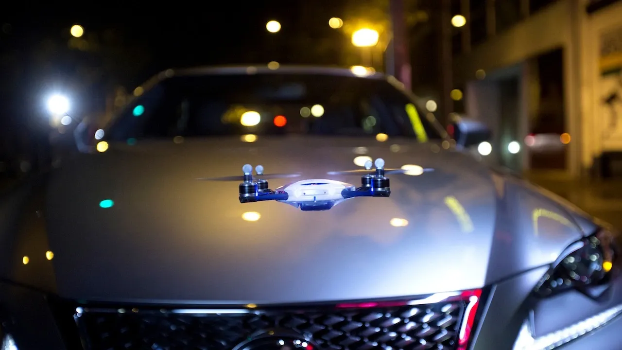 drone in front of a car