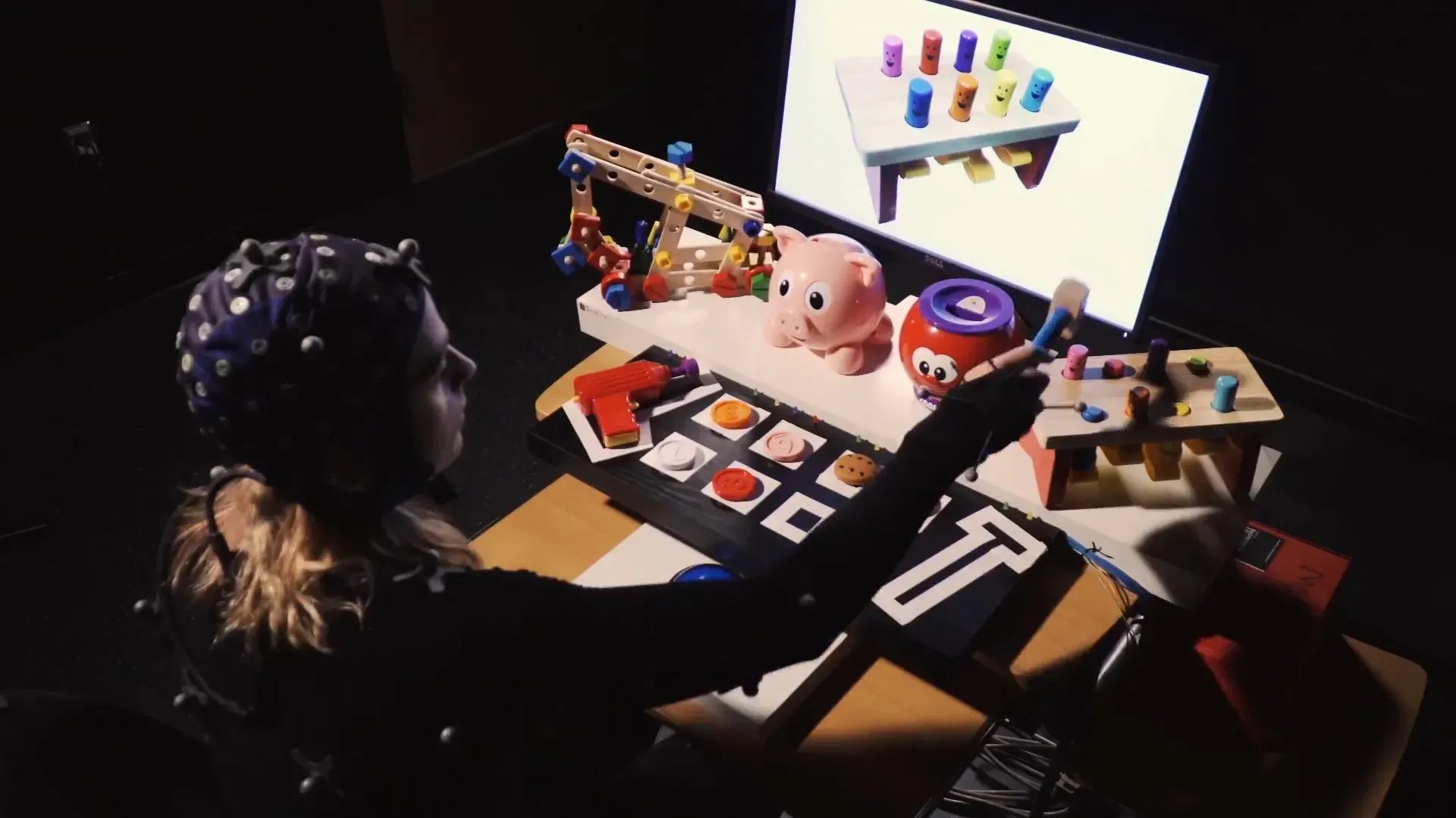 Urmc Neurology Participant Using Toy Hammer